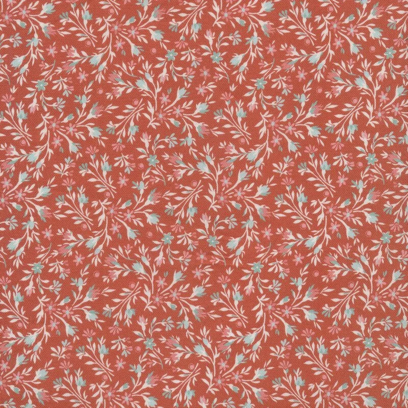 Floral pattern with small blue and pink flowers on a red background