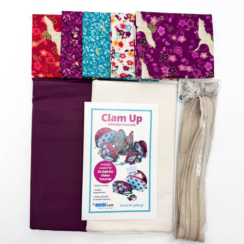 Fabric bundle with colorful patterns, a zipper, and a 'Clam Up' pouch sewing pattern on a white background