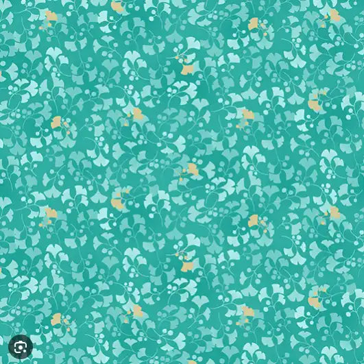 Teal patterned fabric with small floral or abstract shapes