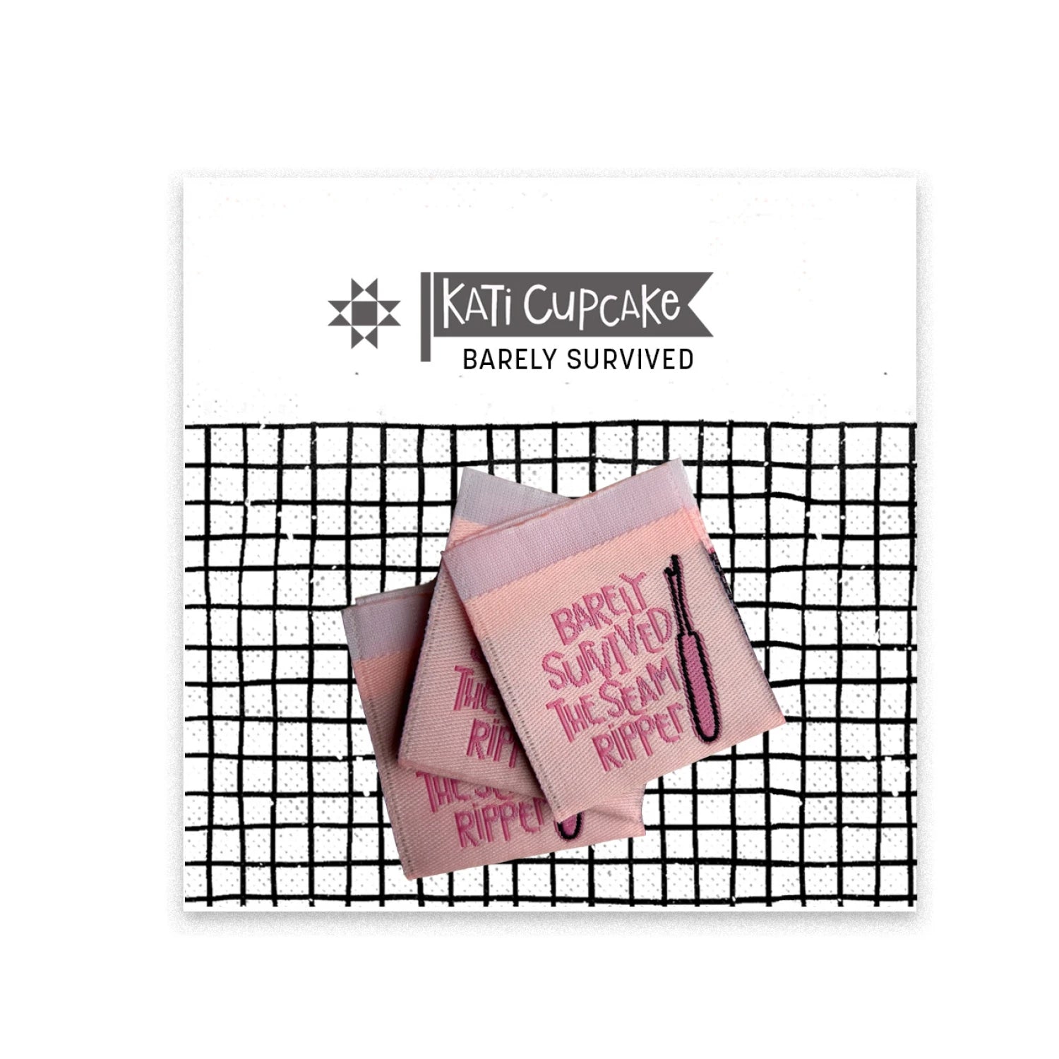 Kati Cupcake pink sewing labels that say "Barely Survived the Seam Ripper" in a black and white package