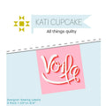 Kati Cupcake pink voila sewing labels in package with a light blue background