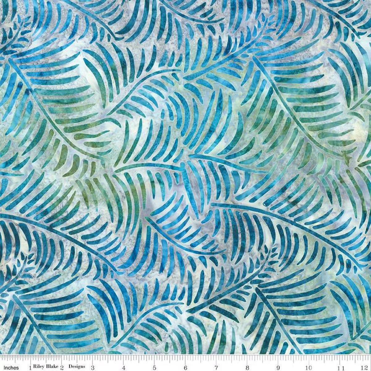 Batik fabric with blue and green leaf pattern on a white background