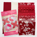 Red fabric with patterns and a pink pillow pattern book on a white background

